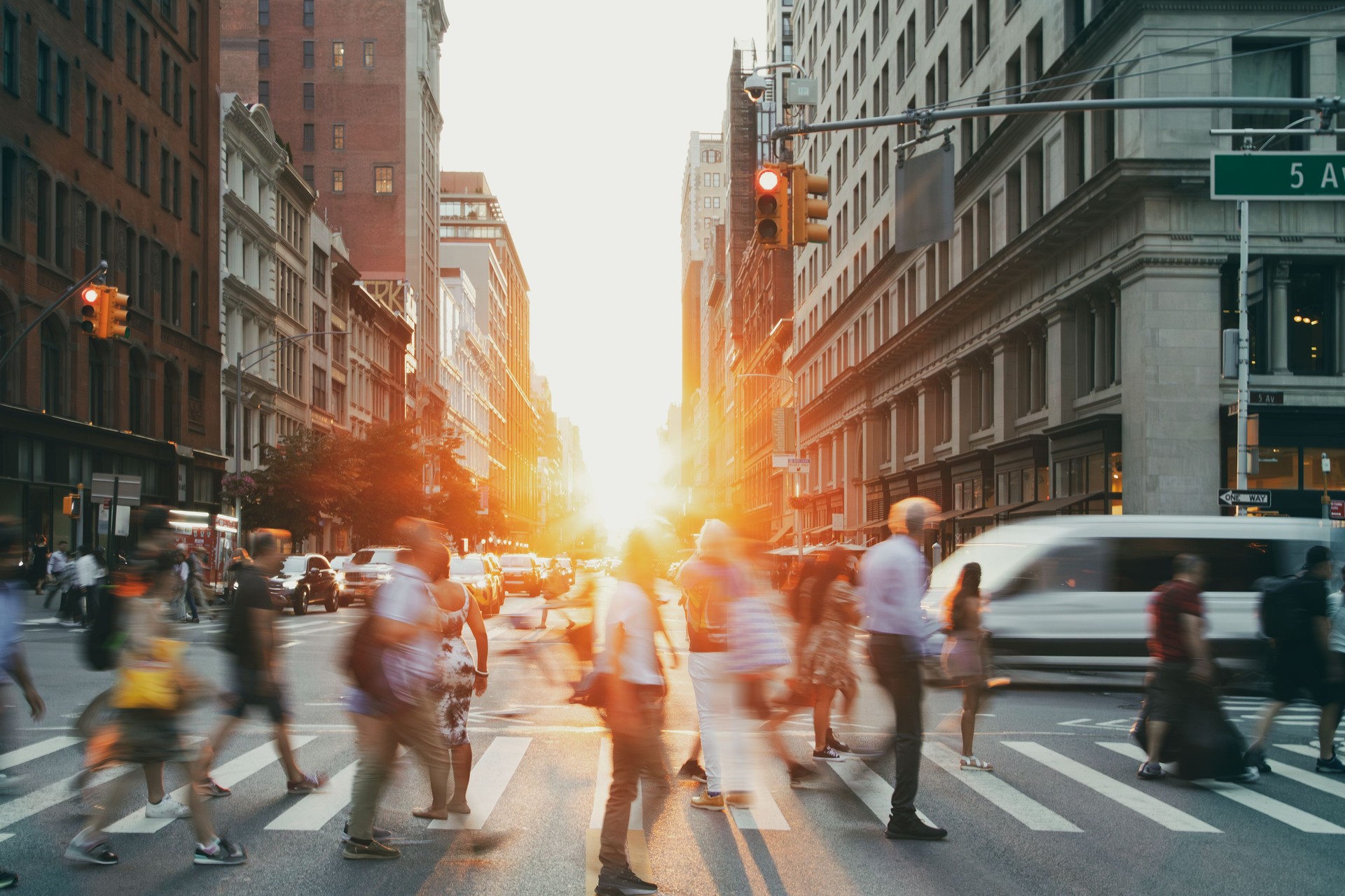 Busy intersection is crowded with people and traffic on 23rd Street in Manhattan New York City NYC